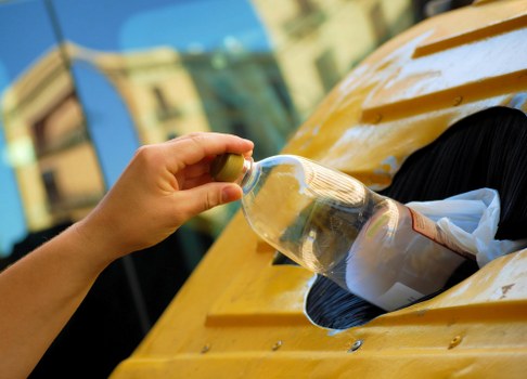 Waste collection team handling rubbish removal in a London street