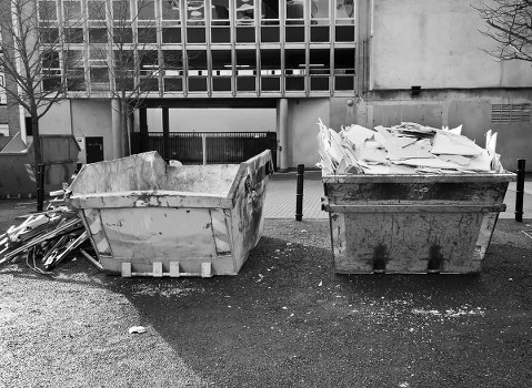 Office clearance team removing desks and chairs from a London office