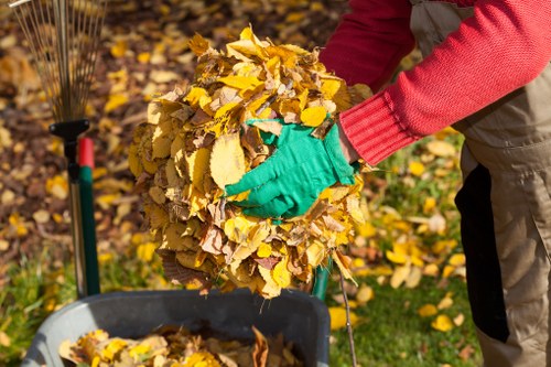 Junk clearance team handling bulky household waste in a London property