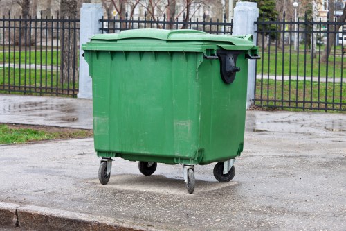 Waste removal team handling bulky items in a London residential street