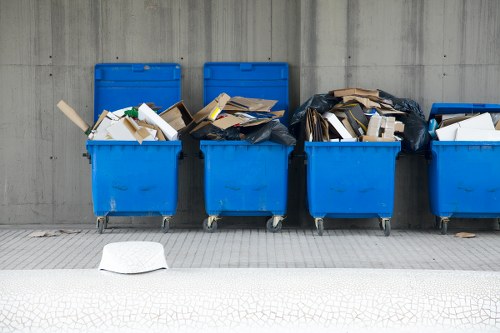 Workers loading bulky waste for a London council waste collection service