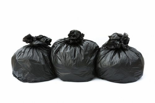 Bulky rubbish being removed from a London flat with narrow access